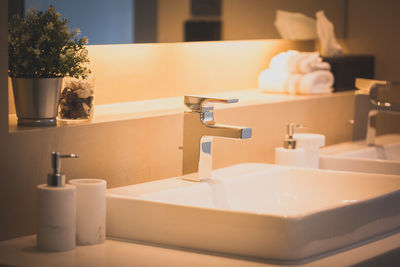 Close-up of faucet in bathroom