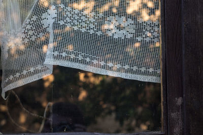 Close-up of city seen through window