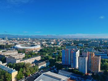 High angle view of buildings against clear blue sky