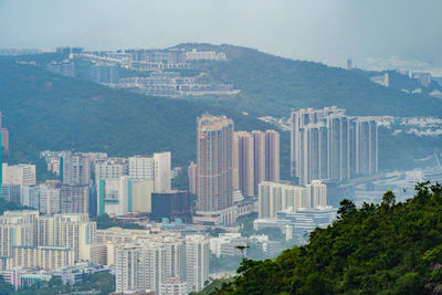 High angle view of buildings in city against sky