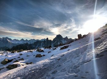 Panoramic view of mountains against sky during winter