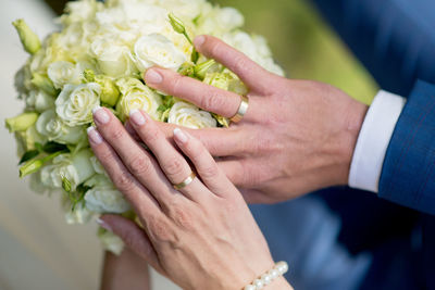 Close-up of hands of couple at wedding