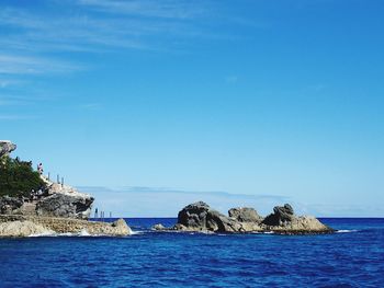 Scenic view of sea against clear blue sky