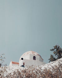 Low angle view of white building against clear sky