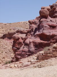 Low angle view of rock formation against clear sky