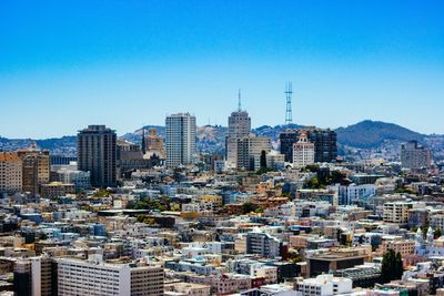 Cityscape against clear blue sky