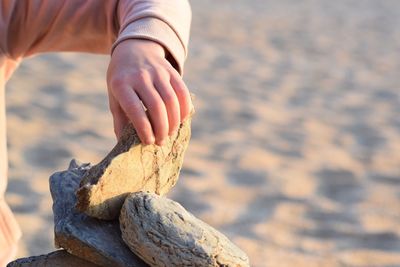 Close-up of hand holding rock