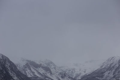 Scenic view of snow covered mountains against sky