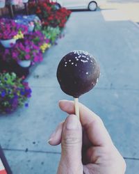 Close-up of hand holding ice cream