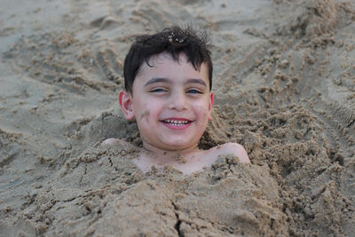 Portrait of smiling boy on beach