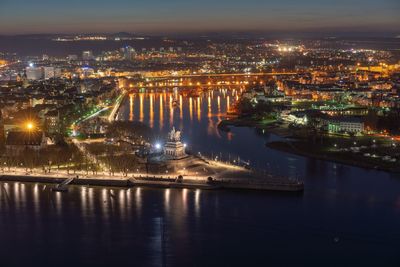 High angle view of illuminated city buildings at night