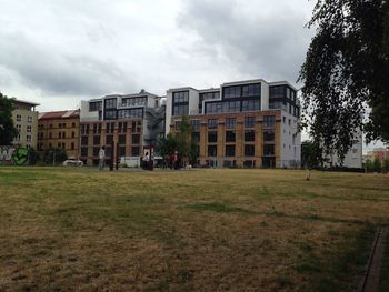 View of buildings against cloudy sky