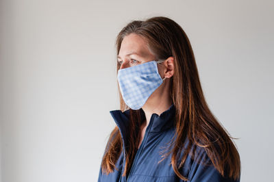 Woman wearing homemade cloth face mask during covid 19 pandemic.