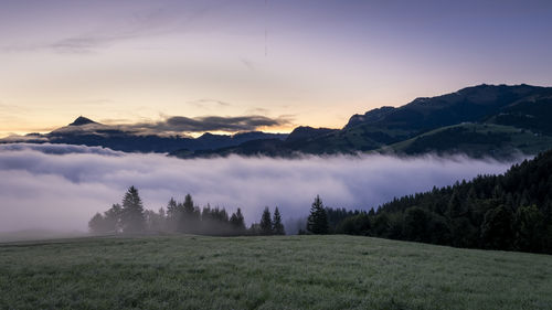 Scenic view of mountains against sky during sunset