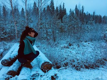 Woman sitting on snow lapland 