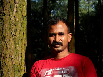 Portrait of man in forest