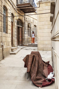 Rear view of a woman walking in building