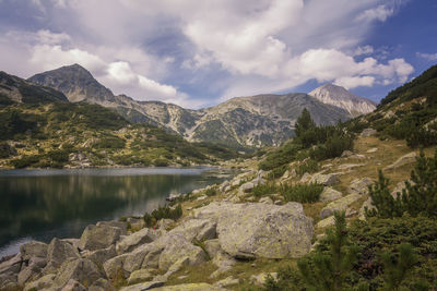 Scenic view of lake and mountains against sky