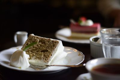 Close-up of cake slice in plate on table