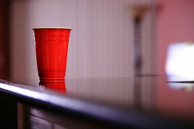 Close-up of red wine in glass on table