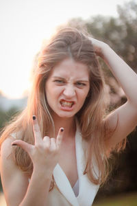 Portrait of young woman gesturing