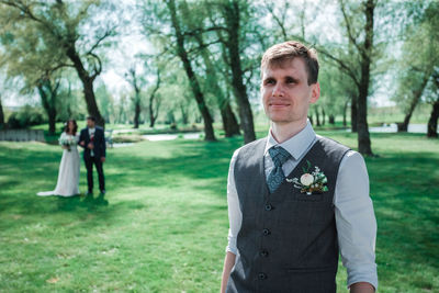 Portrait of man standing in park
