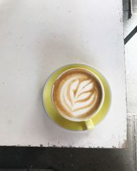 Close-up of cappuccino on table