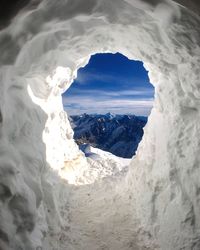 Scenic view of mountains against sky during winter