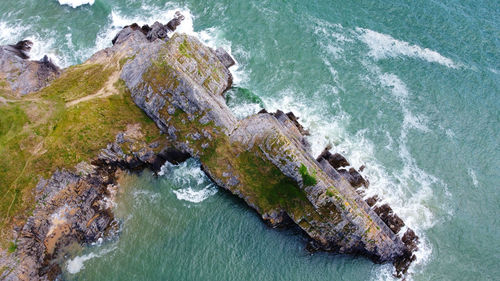 High angle view of rocks in sea