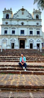 People sitting on staircase of building