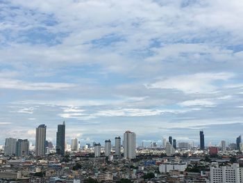 Modern buildings in city against sky