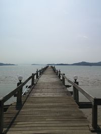 Pier over sea against sky