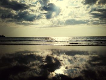 Scenic view of sea against cloudy sky