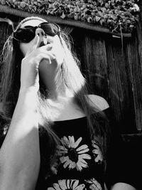 Close-up of young woman smoking cigarette