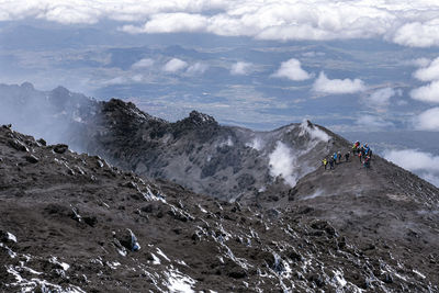 High angle view people standing on mountain