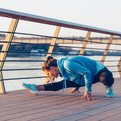 Confident woman exercising in city