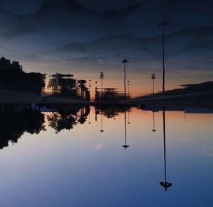 Reflection of clouds in water at sunset