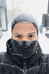 Portrait of woman with snow covered face