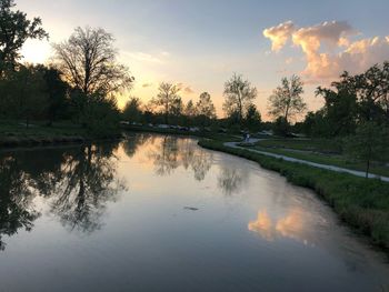 Scenic view of lake against sky at sunset
