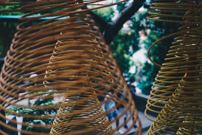 Close-up of spiral hanging outside temple