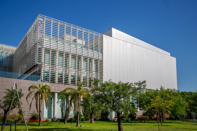 Low angle view of building against clear blue sky