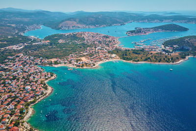 Islands in sea covered with lush greenery, aerial view. rogoznica, croatia