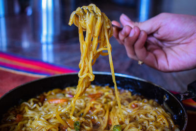 Close-up of person preparing food