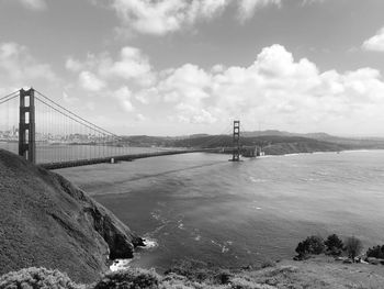 View of suspension bridge over sea