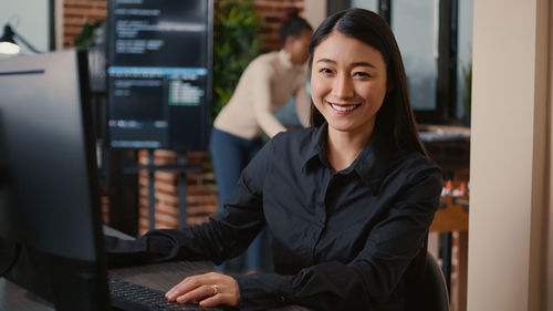 Portrait of smiling businesswoman in office