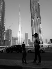 Low angle view of man walking on city street