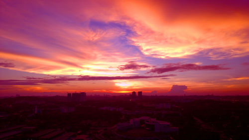 High angle view of buildings against sky during sunset