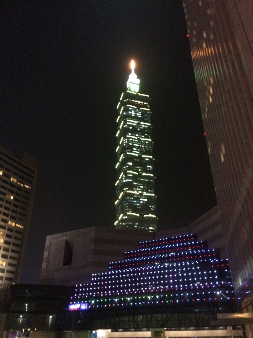 illuminated, night, low angle view, architecture, built structure, building exterior, lighting equipment, city, building, light - natural phenomenon, sky, modern, street light, glowing, tall - high, no people, electric light, outdoors, skyscraper, tower