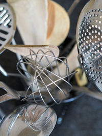 Close-up of kitchen utensils in container