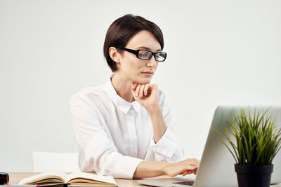 Woman working on laptop at office